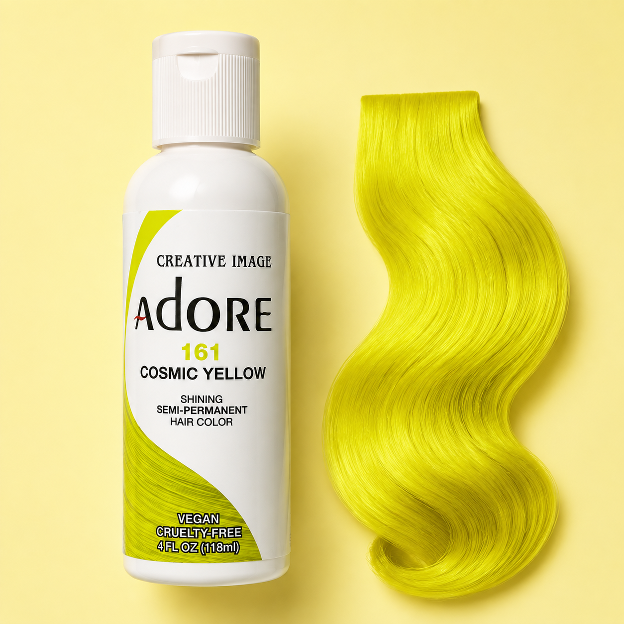     Adore Cosmic Yellow semi-permanent hair dye beside a vivid yellow hair-color swatch