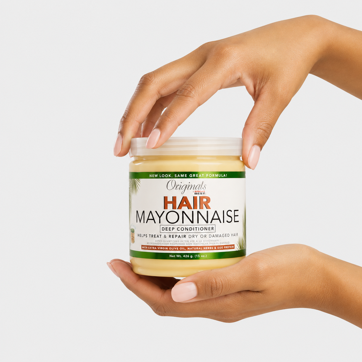 Africa’s Best Originals Hair Mayonnaise Deep Conditioner 15 oz jar held in hands on white background