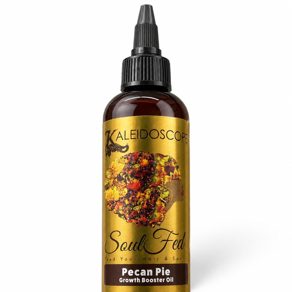 A bottle of Kaleidoscope Soul Fed Pecan Pie Growth Booster Oil, featuring a metallic gold label with a colorful floral design and a black dropper cap, set against a plain white background.