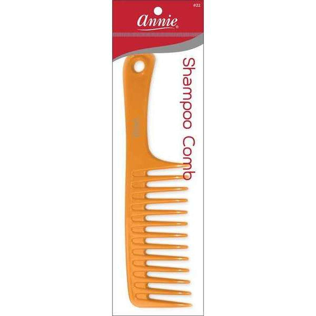 Annie brand orange plastic shampoo comb in retail packaging with a red header card labeled 'Annie' and 'Shampoo Comb'.