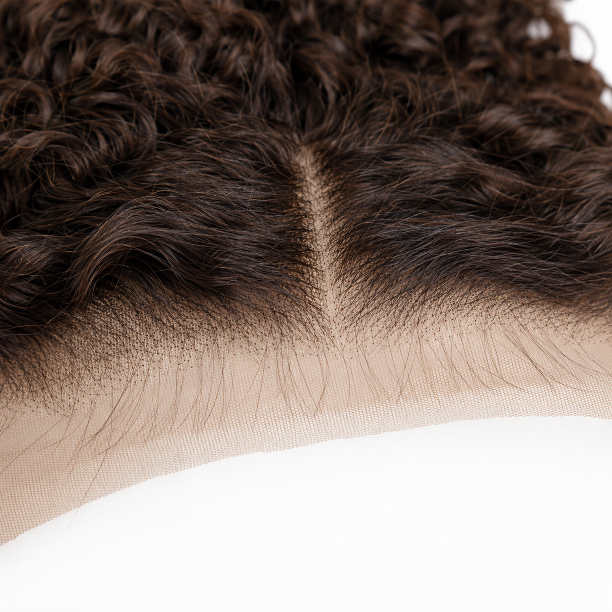 Close-up of a curly wig or lace front hairpiece showing dark brown to very dark ash brown hair texture and the beige lace base against a white background.