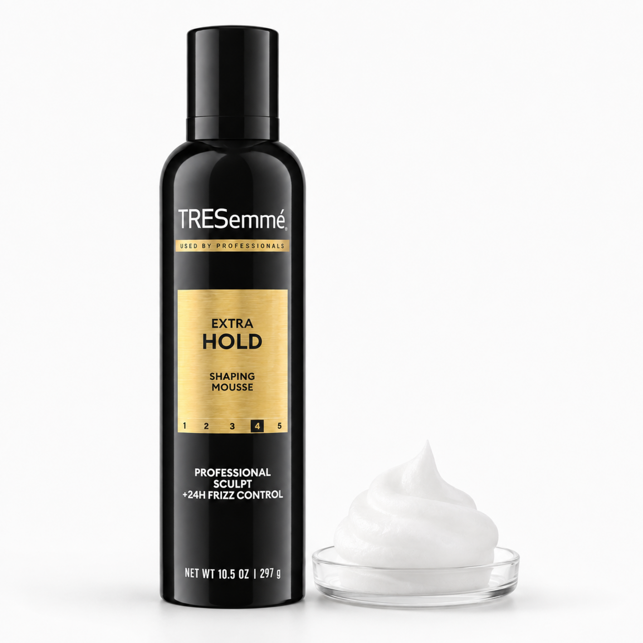 A bottle of TRESemmé Extra Hold Shaping Mousse in black with a gold label, shown next to a dollop of white mousse in a small clear dish on a white background.